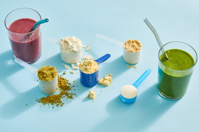 best protein powders selected by good housekeeping on a blue background with scoops of powder
