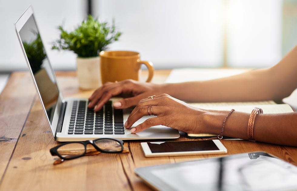 shot of an unrecognizable woman working from home