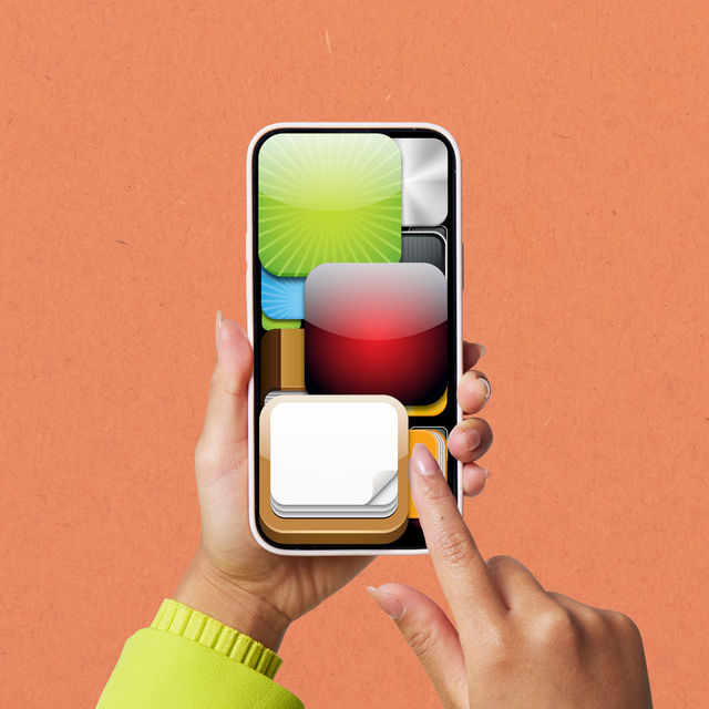 hand holding a smartphone displaying various app icons