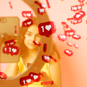 young girl looking into a phone with a ring light young girl looking into a phone with a ring light