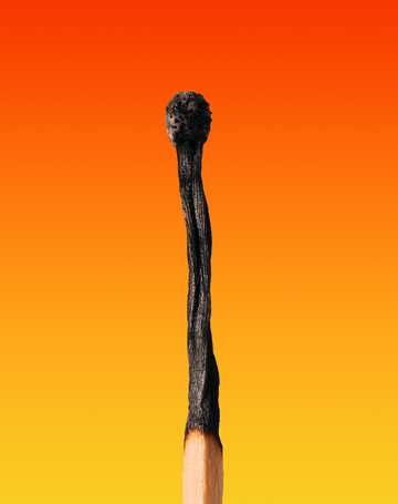 a close up of a burnt out match