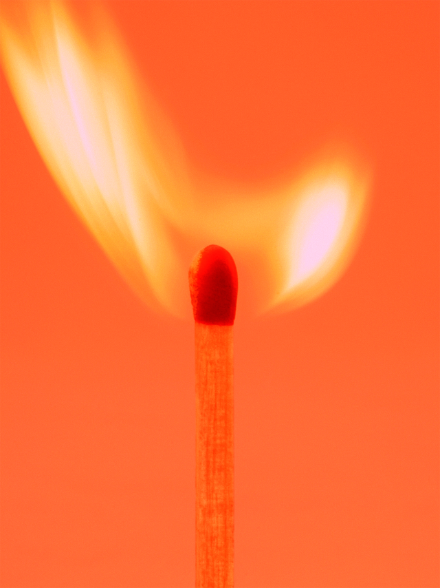 a lit matchstick with a flame