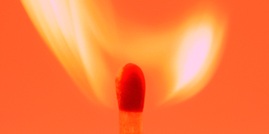 a lit matchstick with a flame
