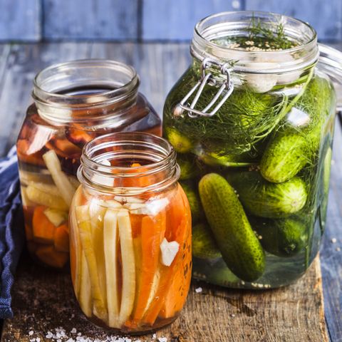 Gherkins fermenting, gherkins and carrots in preserving jars