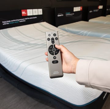 best adjustable beds - index a person holding a remote for an adjustable bed