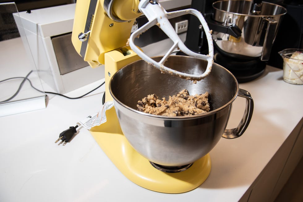 kitchenaid design series stand mixer in butter yellow with cookie dough in mixing bowl