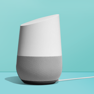 google home smart speakers on a blue background