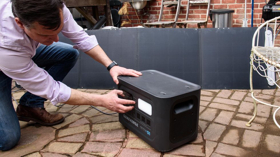 a good housekeeping expert tests the solar panel capacity of a solar generator