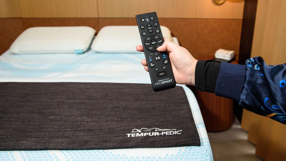 best smart mattresses - how we test an analyst evaluates the controls on the remote of the tempur pedic prosmart adjustable base