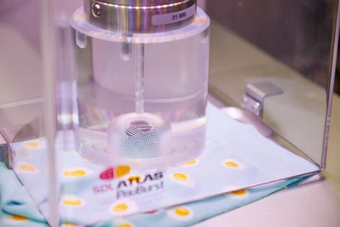 best socks for women - how we test a cut up blue sock with cartoon sunny side up eggs in a bursting strength testing machine with a hole