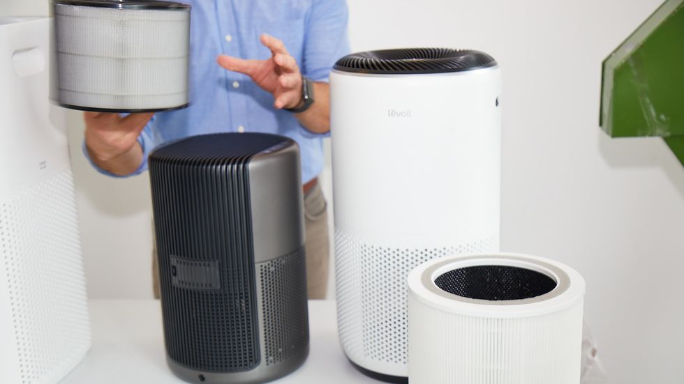 an expert examines the filters on air purifiers