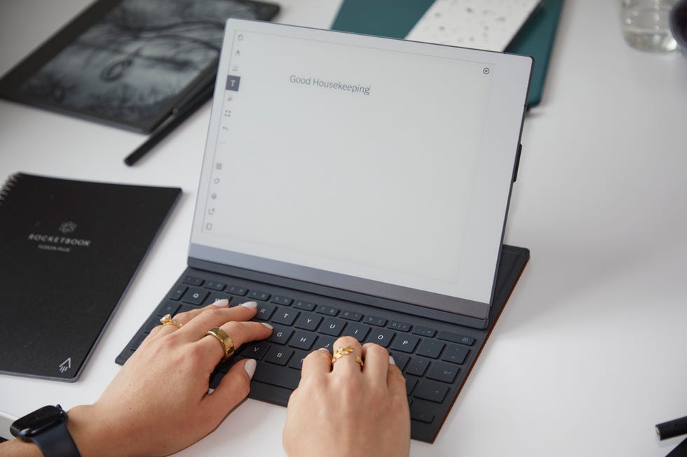 a person typing on a laptop