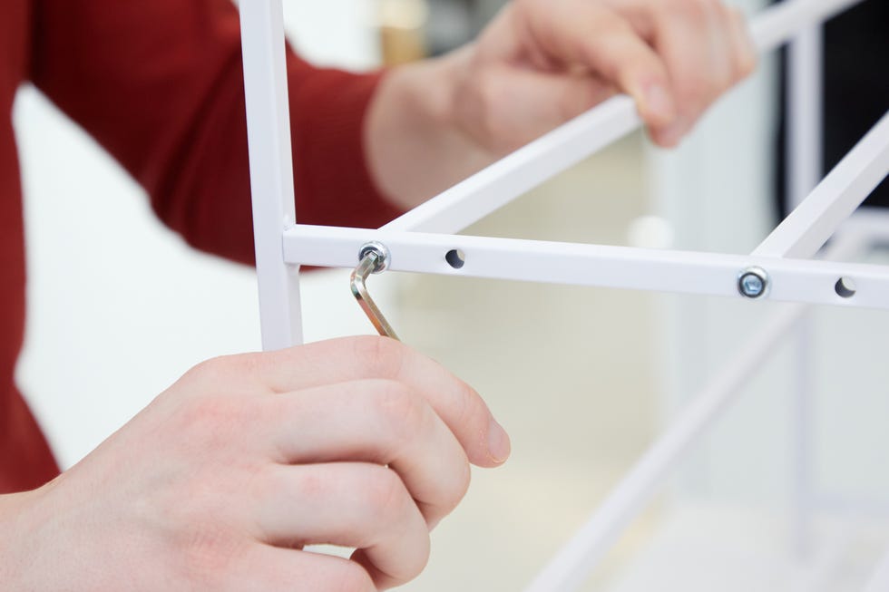 best shoe racks person assembling a shoe rack