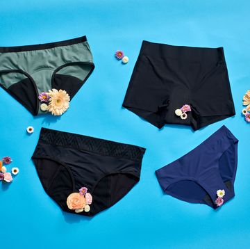 four pairs of period underwear on a blue set with flowers, good housekeeping's best period underwear