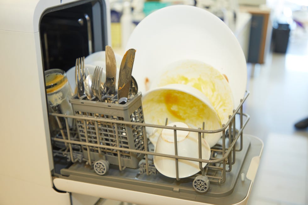 dirty dishes in a portable dishwasher