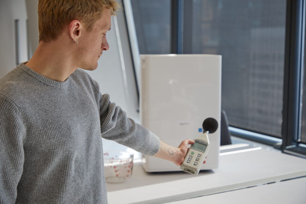an expert measures how much noise a dehumidifier makes while running