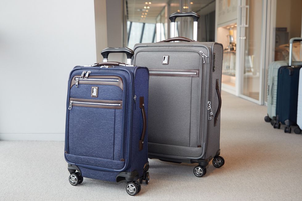 two travelpro suitcases in a hallway
