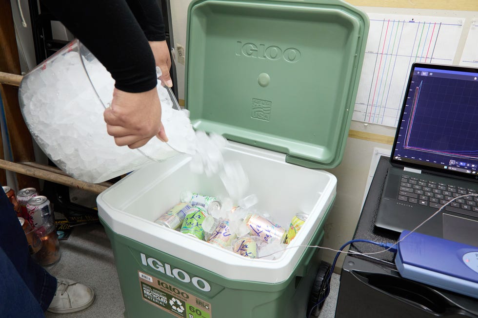 pouring ice inside of a cooler