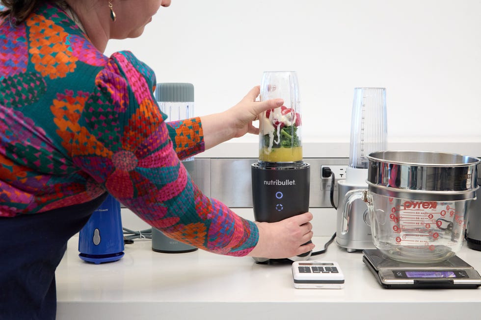 ingredients in a smoothie in a personal blender