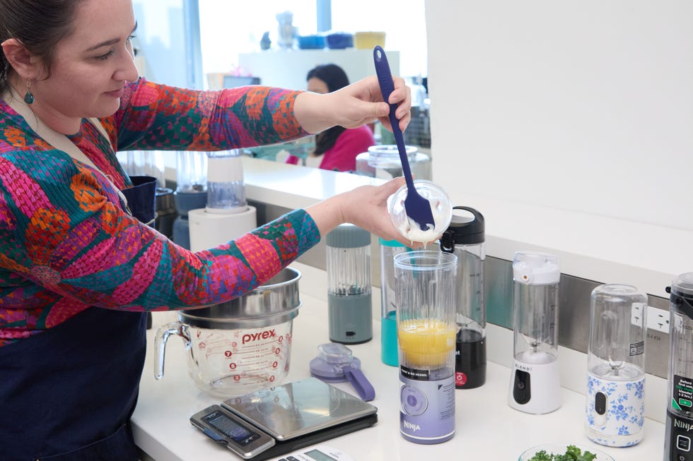 pouring yogurt into portable blender