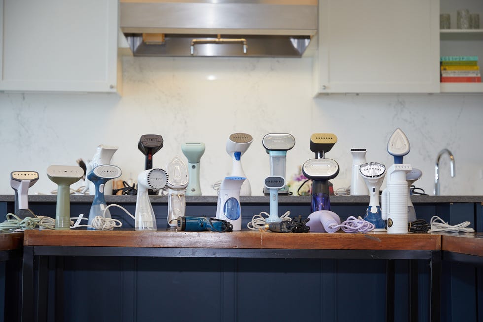 garment steamers lined up on a countertop