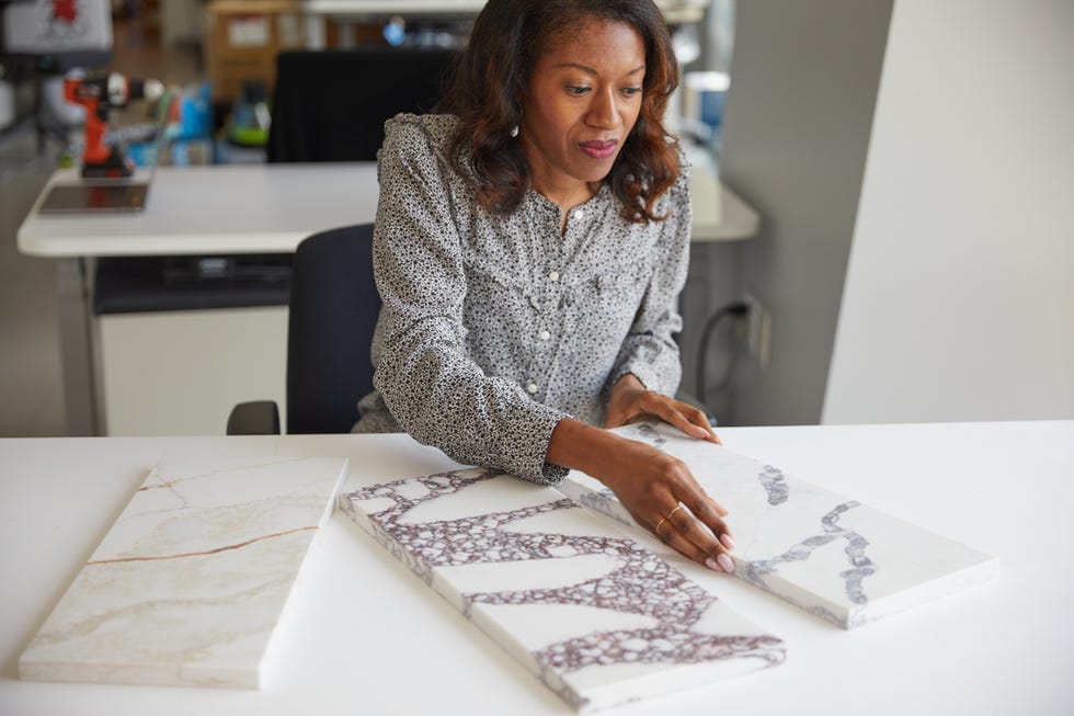 a design expert evaluates the style of different countertop samples