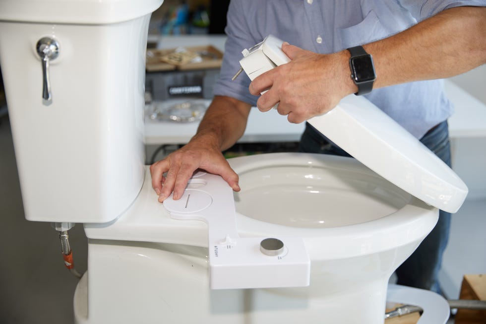 an expert tests a bidet attachment