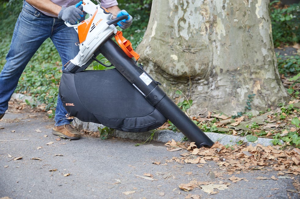 an expert from the good housekeeping institute runs field tests on a leaf vacuum