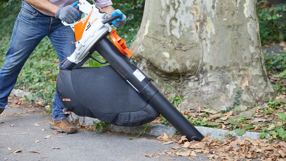 an expert from the good housekeeping institute runs field tests on a leaf vacuum