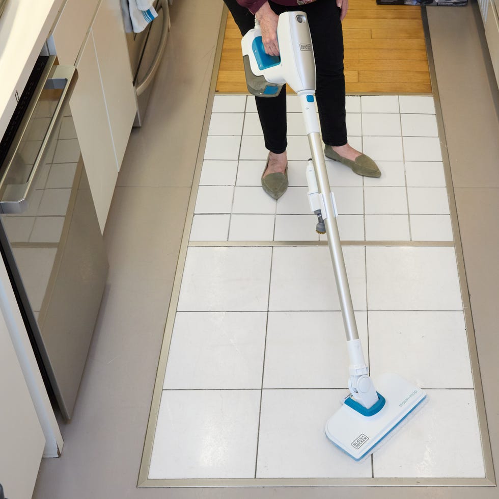 Best Steam Mops: BLACK+DECKER Steam Mop white and blue steam mop on a white tiled floor