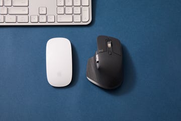 best computer mice of 2024, logitech mx master 3s and apple magic mouse on blue background, with keyboard in the corner