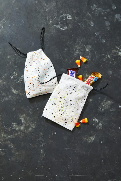 halloween party ideas, two white candy bags with splattered paint designs
