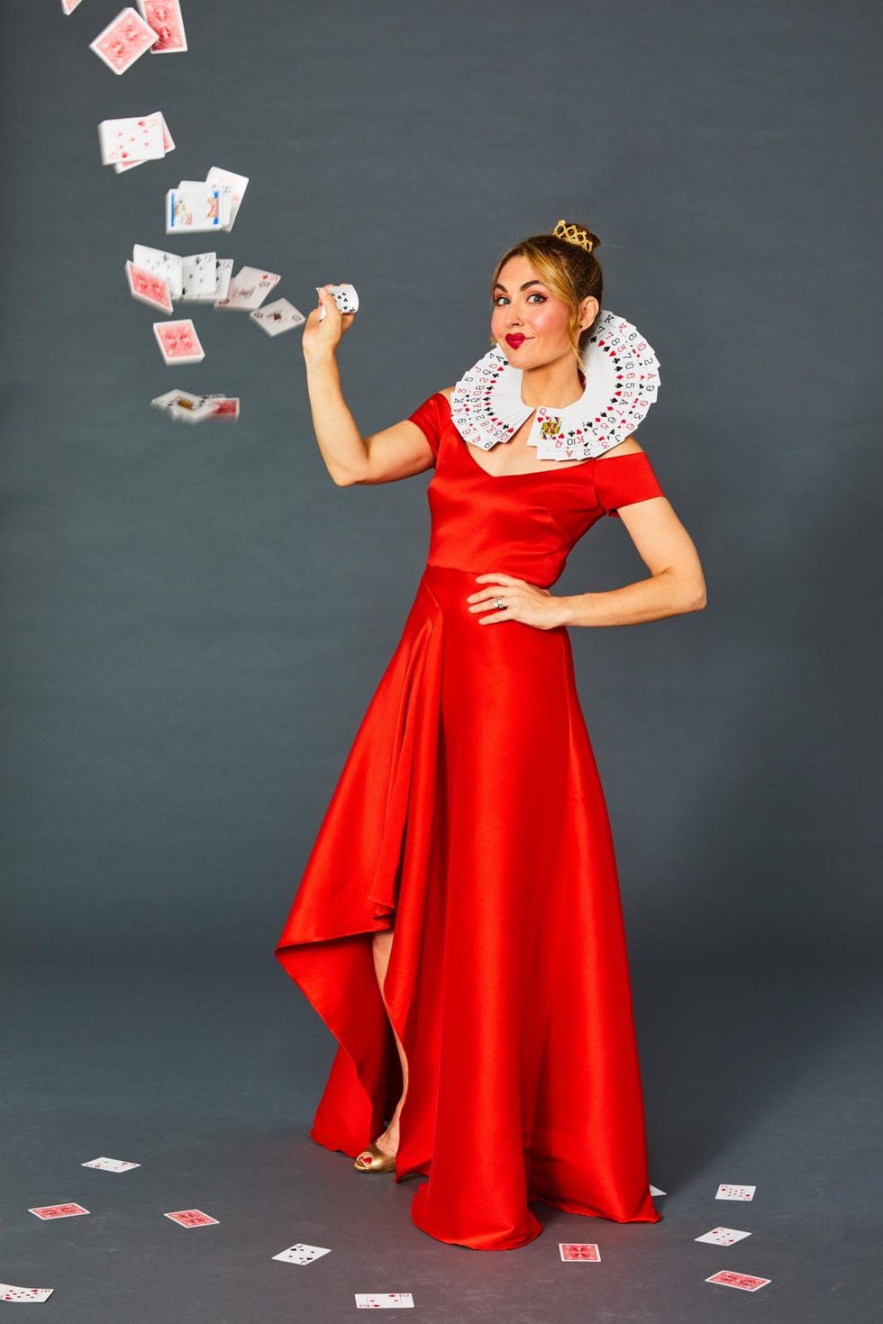 homemade halloween costumes, woman wearing a red dress and holding deck of cards