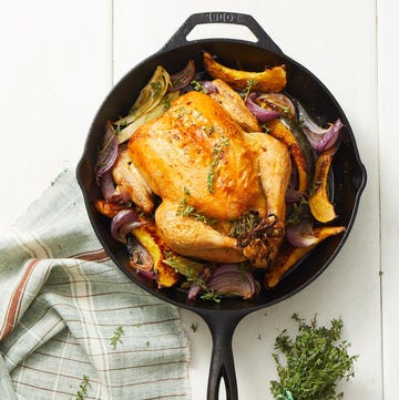 Roasted chicken with vegetables in a skillet Roasted chicken with vegetables in a skillet