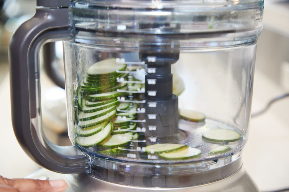sliced zucchini in a food processor