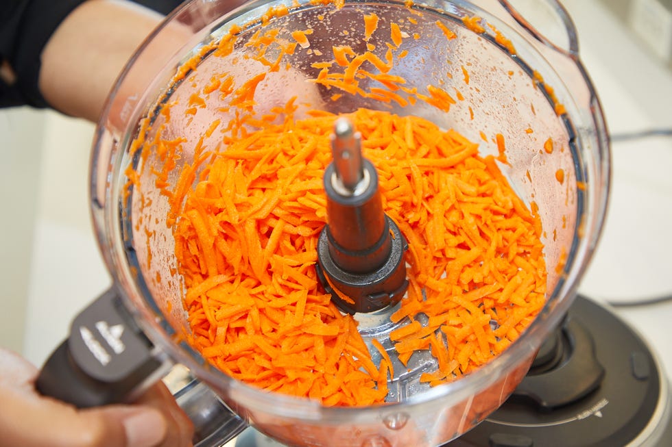 shredded carrots in a food processor bowl