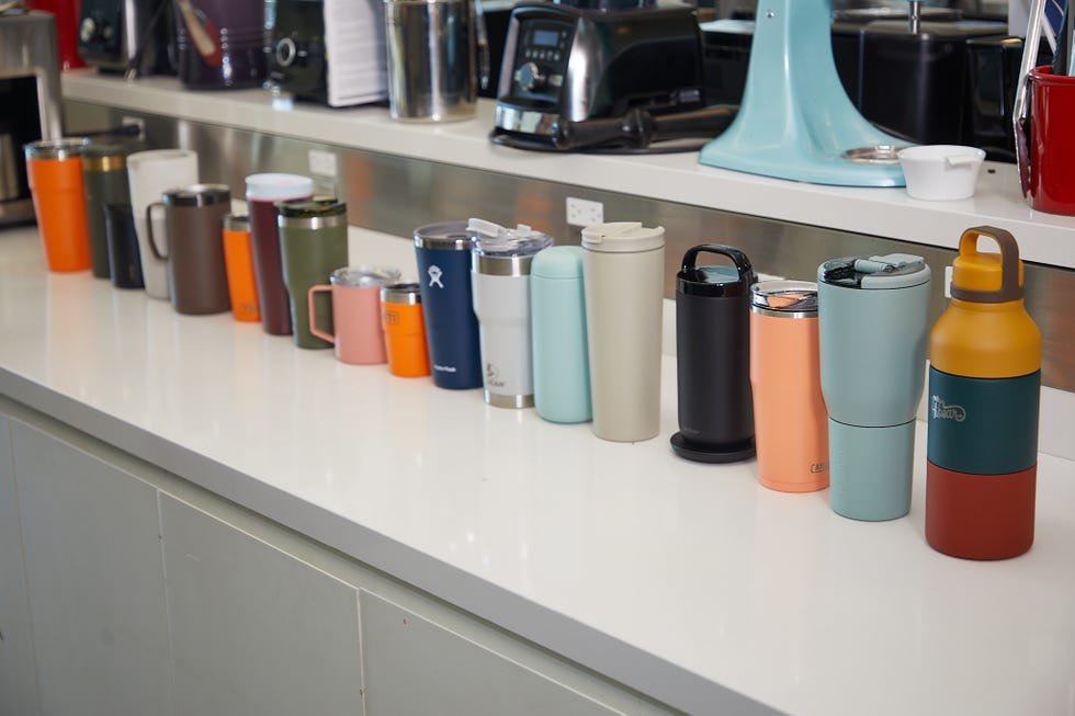 multiple travel mugs side by side