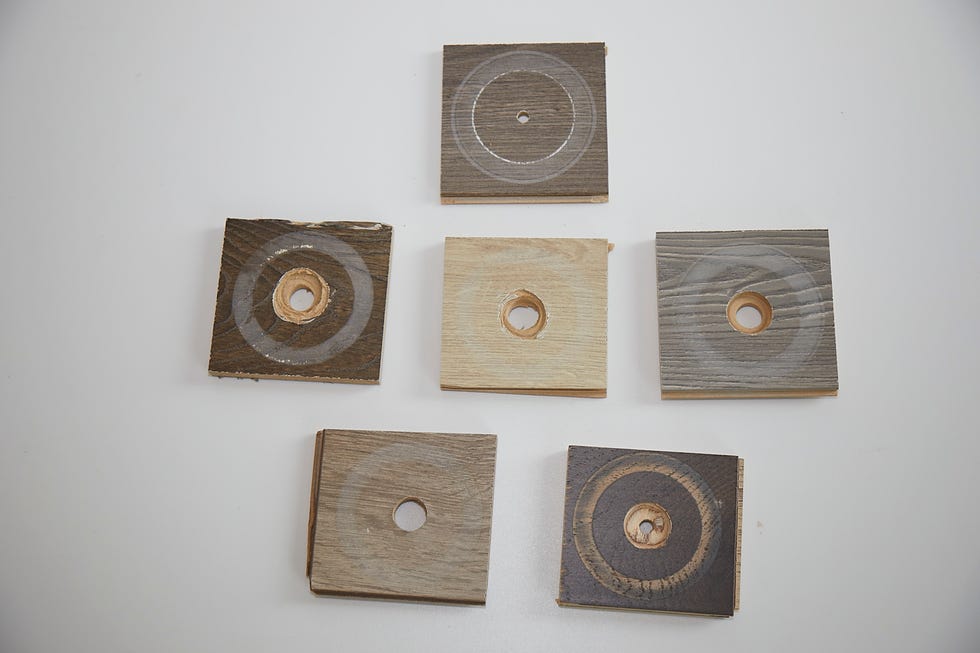 an assortment of laminate samples after they have undergone an abrasion test