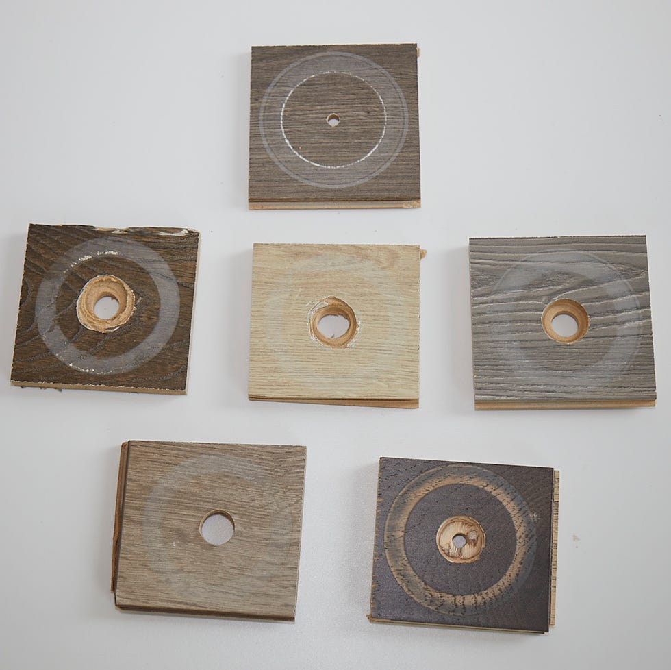 laminate floor testing an assortment of laminate samples after they have undergone an abrasion test