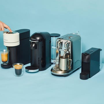 side by side nespresso machines on blue background side by side nespresso machines