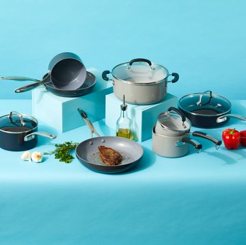 ceramic cookware pans on blue background