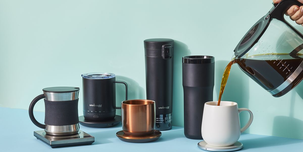 a collection of heated mugs with a hand pouring a pot of coffee into one