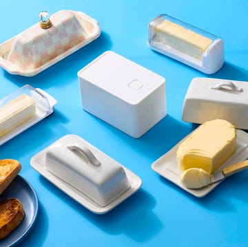 various butter dishes and butter spread with toasted bread various butter dishes and butter spread with toasted bread