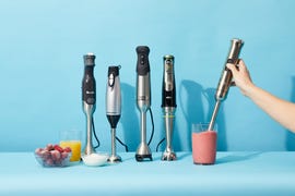 a hand hold an immersion blenders to blend a pink smoothie as part of a lineup of the immersion blenders tested by the good housekeeping institute