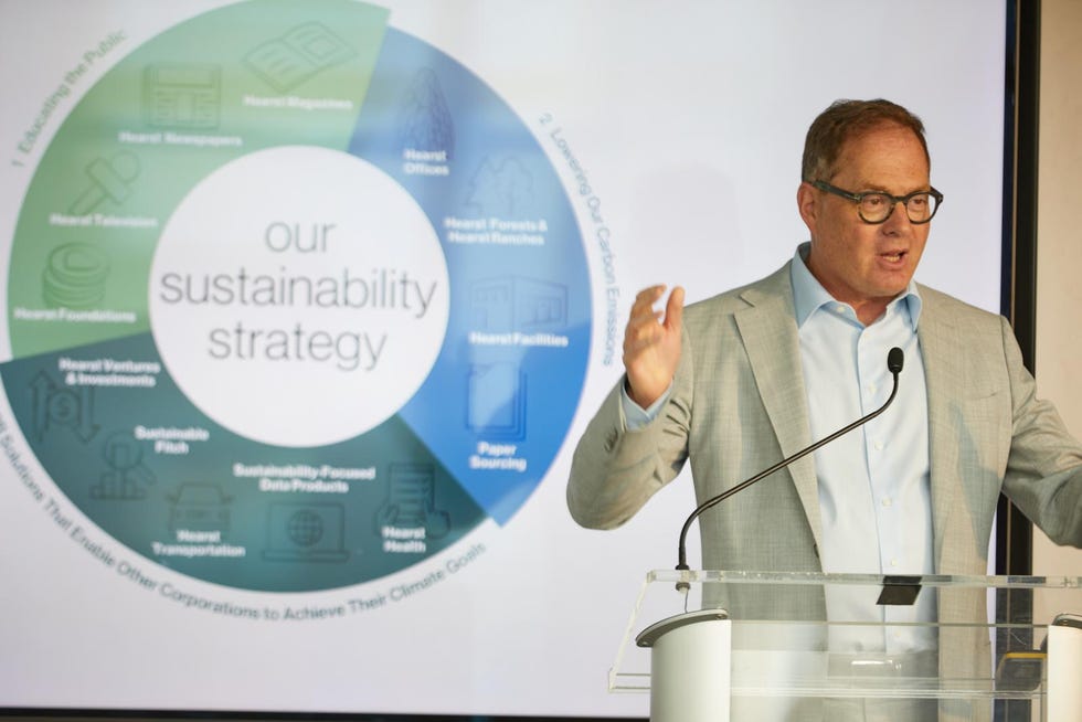good housekeeping's raise the green bar summit opening speaker david carey standing in front of a power point slide