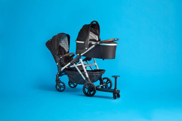mockingbird single to double shown with the ride board so that it can hold three children, part of a good housekeeping review of the mockingbird stroller