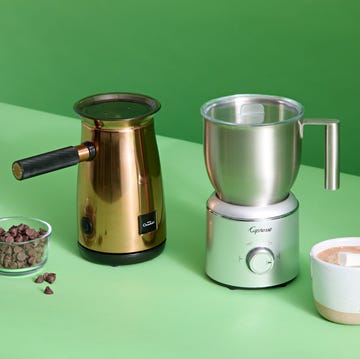 two hot chocolate makers with chocolate chips and a cup of cocoa two hot chocolate makers with chocolate chips and a cup of cocoa
