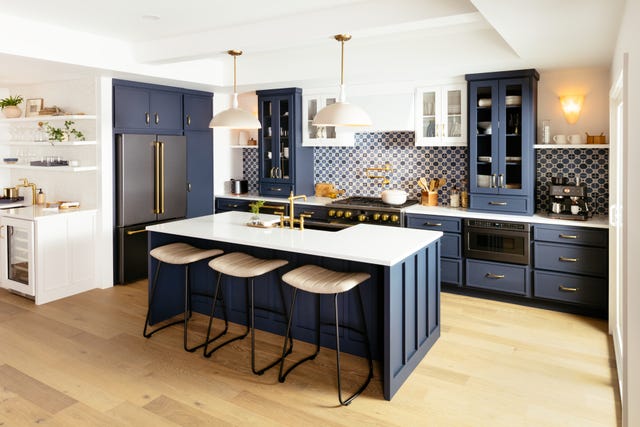 a kitchen with a bar stool and a table