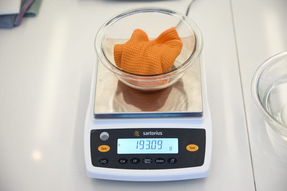 digital scale displaying weight of an orange cloth