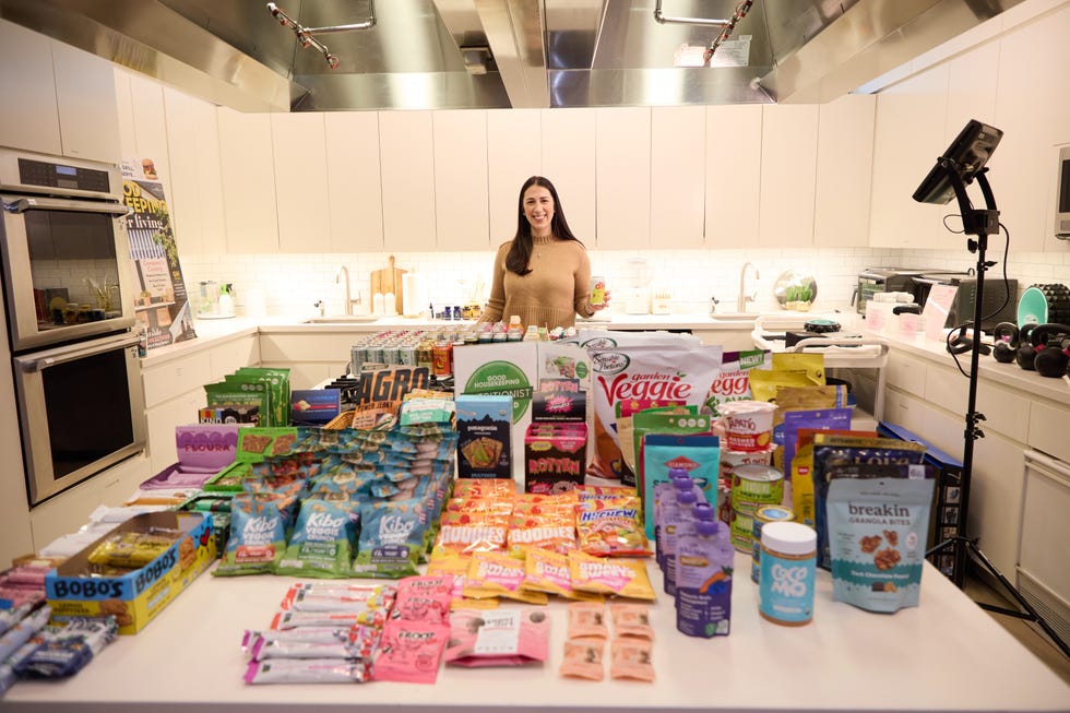 nutrition director with a variety of snacks for testing